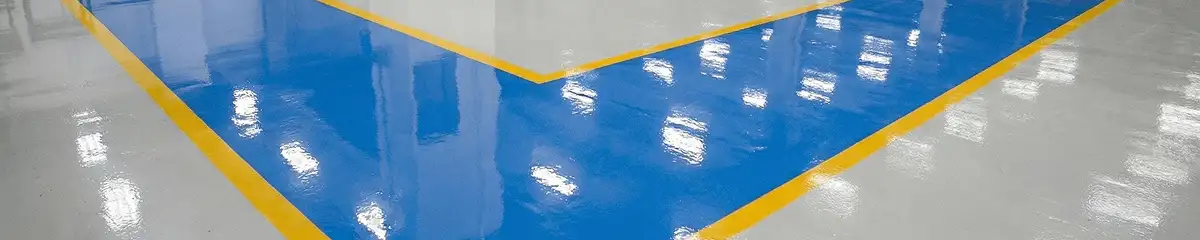 A factory floor professionally covered and marked with epoxy flooring in Boulder, CO