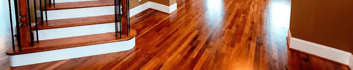 Base floor of a staircase with professionally restored wood flooring in Boulder CO