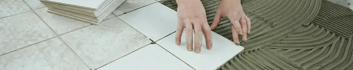 Professional installing white tile floors in Boulder, CO