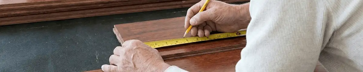 A professional installing wood flooring in Boulder, CO